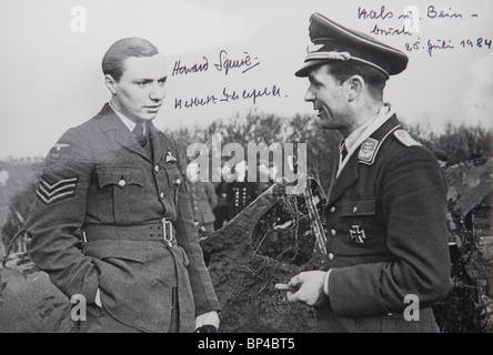 Photo of captured British airman and his downed Spitfire with German pilot who shot it down. Stock Photo
