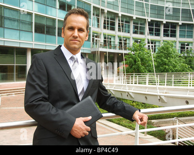 Business man holding diary Stock Photo