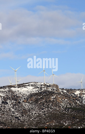aerogenerator electric windmills on snow mountain Stock Photo