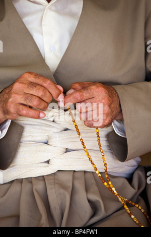 Kurdish Iraqi man counting Muslim prayer beads in Dohuk, Kurdistan, Iraq Stock Photo