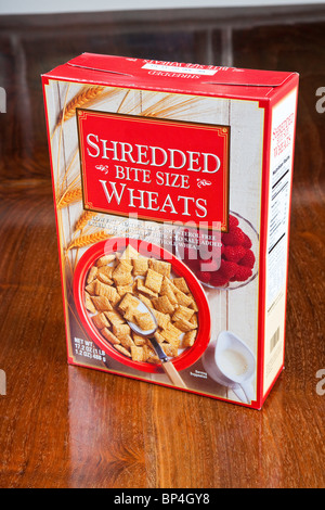Shredded wheat cereal box on wooden table Stock Photo