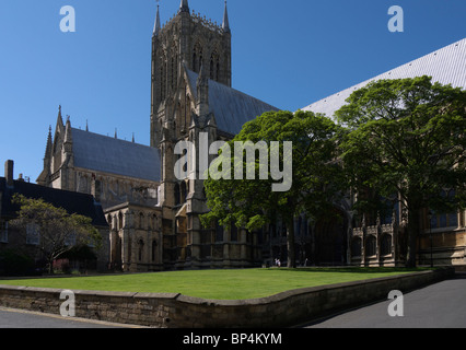 Lincoln cathedral seen from the south side square. on a bright summers day with the trees in full bloom Stock Photo