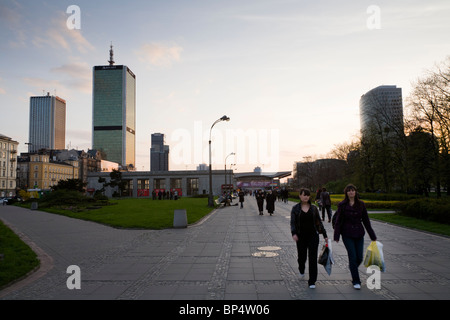 People walking from 'Warsaw Central Rail Station' on 'Parade Square' (Plac Defilad), Warsaw Poland. Stock Photo