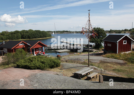 Sailing boats and wooden rowing boats docked at Rödhamn at the archipelago in Lemland on Aland island in Finland Stock Photo