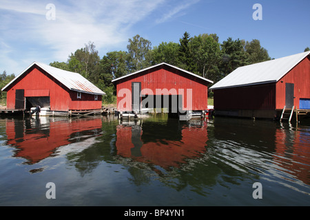 A row of boathouses in Västeränga, Lemland on the Aland island archipelago Finland Stock Photo