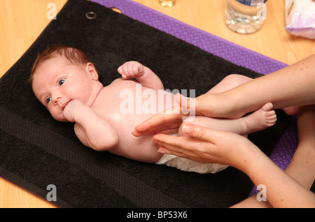 Baby massage. Stock Photo