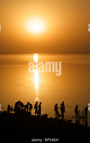 People washing in the river Niger at sunset during the Festival sur le Niger, Segou, Mali, West Africa Stock Photo