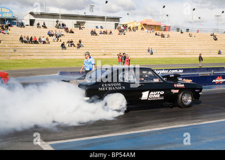 Drag racing Ford Capri performing a massive tyre smoking burnout at Western Australia's Perth Motorplex Stock Photo