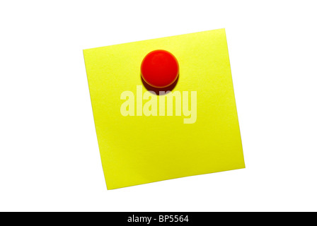 Yellow sticky notepaper with red magnet. Isolated on white with clipping path. Stock Photo