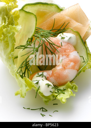 A prawn with smoked salmon lettuce cucumber slices and dill Stock Photo