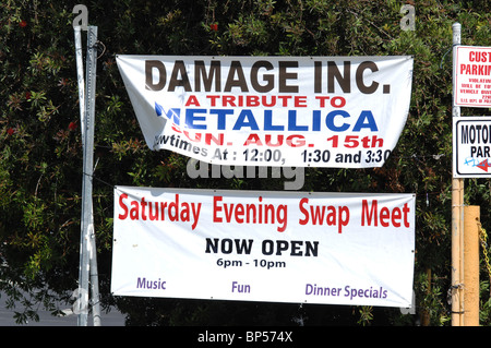 A swap meet event attracts shoppers by hosting a tribute band to rockers Metallica. Stock Photo