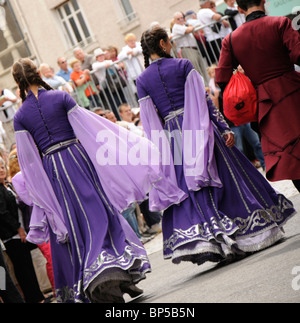 Dancers in traditional dress from the Balkans getting ready for the parade at the Confolens 53rd World Music Festival 2010 Stock Photo