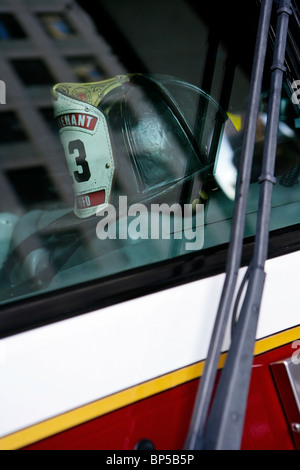 A Fire fighters helmet on the dash of a San Francisco Fire engine Stock Photo