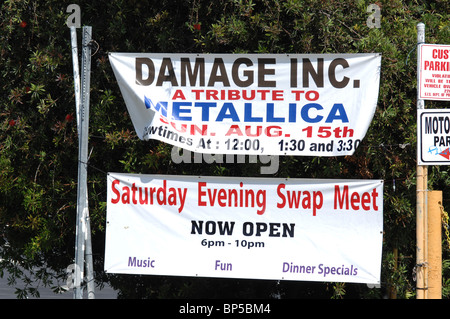 A swap meet event attracts shoppers by hosting a tribute band to rockers Metallica. Stock Photo