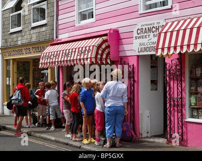 Children line up for a treat at Cranch's Sweet Shop, Salcombe, South Hams, Devon Stock Photo