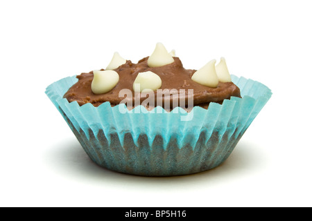 Home made milk chocolate cupcake with white chocolate drop decoration. Stock Photo