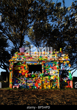 Small house made out of toys, exhibited during the 'Sculpture by the Sea' event in Sydney, Australia Stock Photo