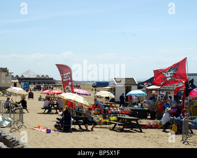 A busy beach and cafe on the beach at Weston-Super-Mare,Somerset,UK. Stock Photo