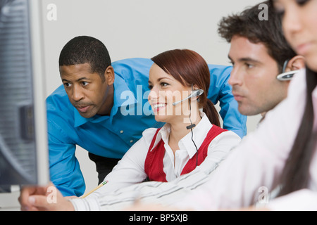 People Wearing Headsets in Office Stock Photo