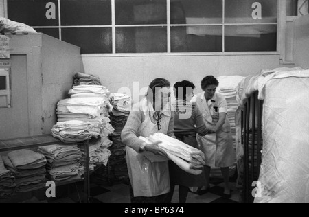 Winter of Discontent London 1979 UK. Family & friends come in to help those staff not striking. Westminster hospital laundry room. 1970s  HOMER SYKES Stock Photo