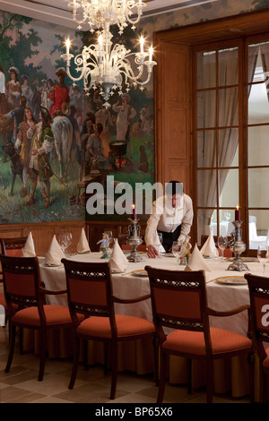 Waiter setting a banquet table Stock Photo