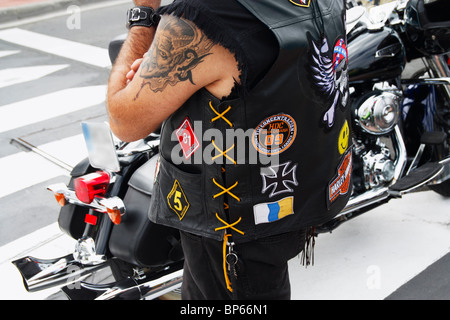 Harley Davidson owner standing next to bike in Spain Stock Photo