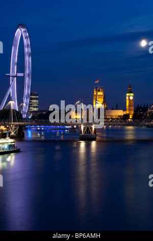 Millennium wheel and Houses of Parliament at dusk, London, UK. Stock Photo