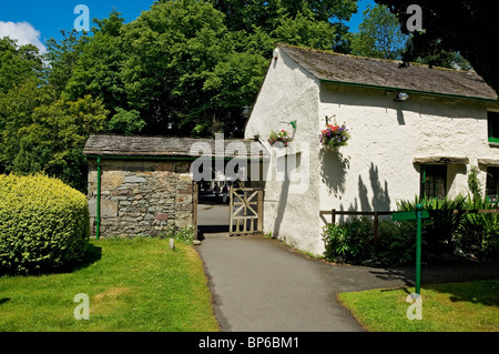 Rear of the Grasmere Gingerbread shop store in summer from St Oswald's churchyard Cumbria England UK United Kingdom GB Great Britain Stock Photo