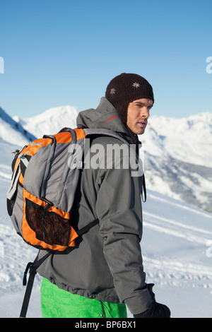 Young man in ski wear looking away Stock Photo