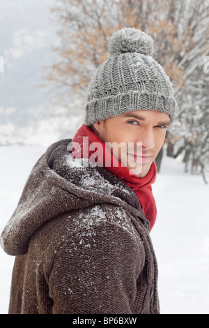 Young man in winter clothes looking at camera Stock Photo