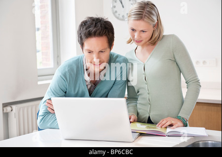 Couple working on a laptop Stock Photo