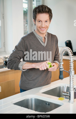 Portrait of a man working in the kitchen Stock Photo