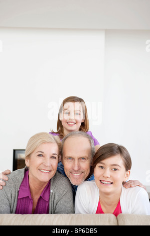 Couple smiling with their granddaughters Stock Photo