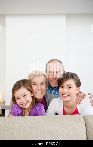 Couple smiling with their granddaughters Stock Photo