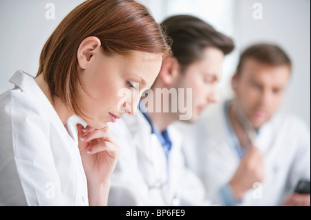 Female doctor working with her colleagues Stock Photo