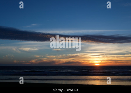 View at sunset of Ninety Mile Beach, New Zealand Stock Photo