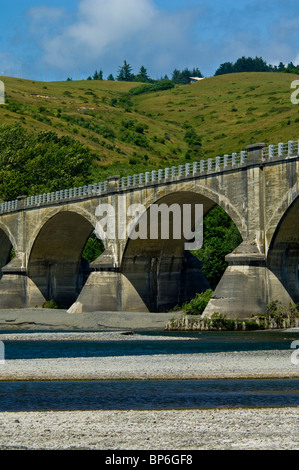 Historic Fernbridge (c.1911) stretches over the Eel River, near Ferndale, California Stock Photo