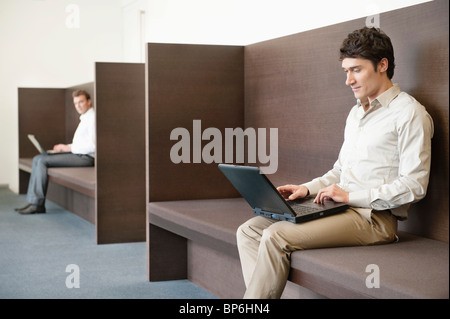 Two businessmen working in an office Stock Photo