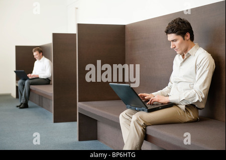 Two businessmen working in an office Stock Photo