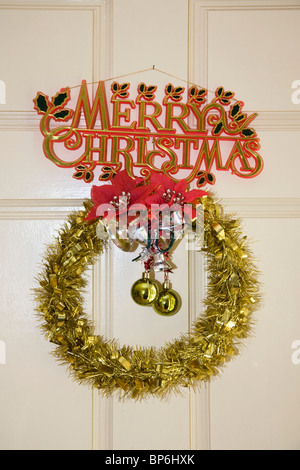 Detail of Christmas decorations hanging on a door Stock Photo