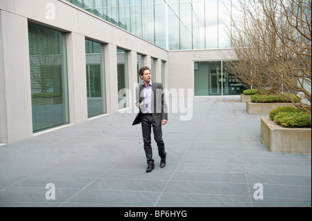 Businessman text messaging on a mobile phone Stock Photo