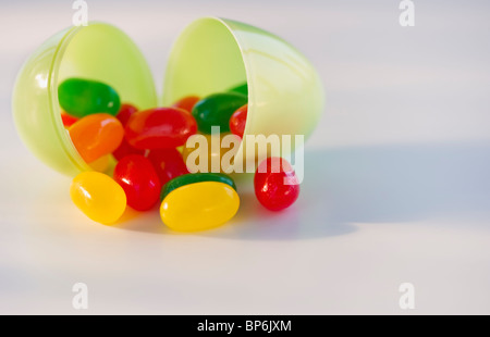 Jelly beans in a plastic Easter egg Stock Photo