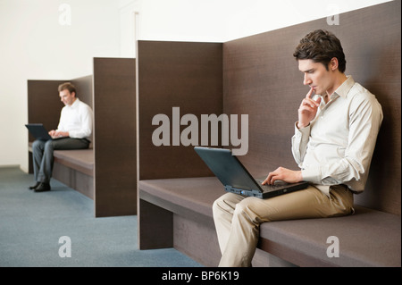 Two businessmen working in an office Stock Photo