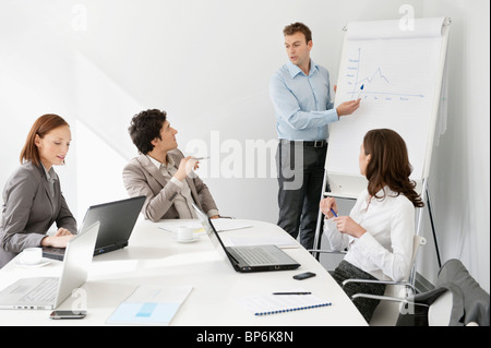 Businessman giving presentation in a meeting Stock Photo