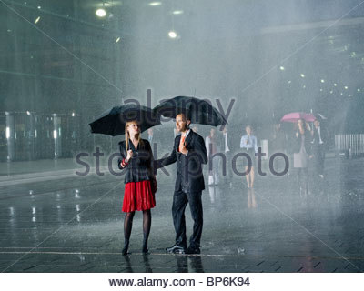 Two people under umbrellas Stock Photo: 7142042 - Alamy