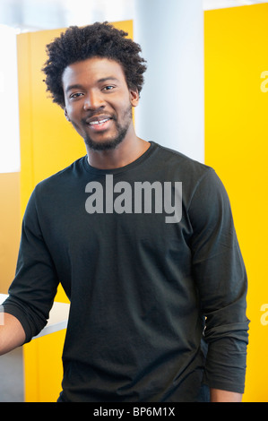 Businessman smiling in an office Stock Photo
