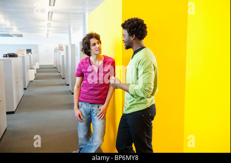 Businessmen standing in an office Stock Photo