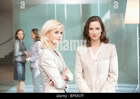 Two businesswomen standing together Stock Photo