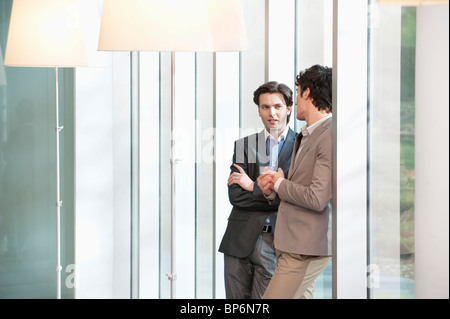 Two businessmen standing together Stock Photo