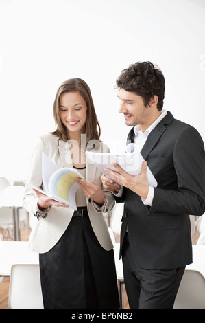 Business executives looking at documents Stock Photo